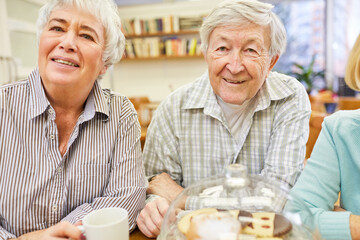 Couple of seniors having coffee in retirement home