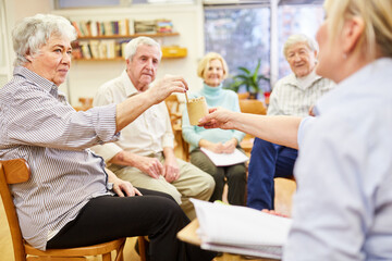 Psychotherapist and seniors play a game