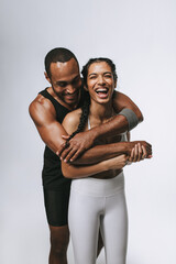 Portrait of fit couple having fun at workout