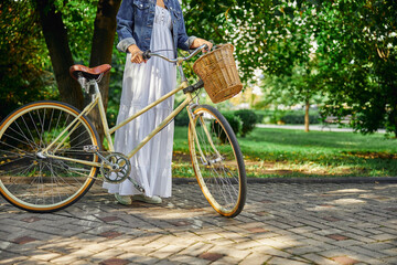 Naklejka premium Woman enjoying good summer weather in country park