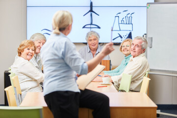 Lecturer and senior citizens in the seminar on environmental protection