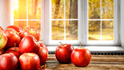 Fresh red apples and window of autumn time 