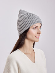 Beautiful woman in autumn hat on a white background. Autumn warm clothes