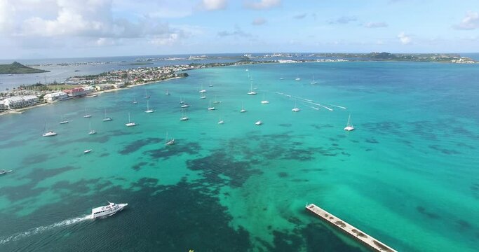 Aerial view of the blue Caribbean sea fill with boats and yacht 