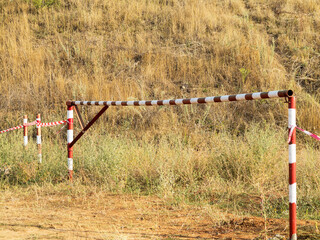 Red and white striped warning about danger and limited access tape tape. Red and white striped...