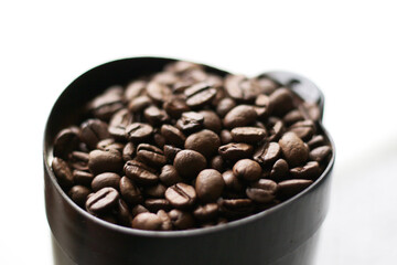 roasted coffee beans in coffee grinder