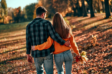 Couple in park in autumn