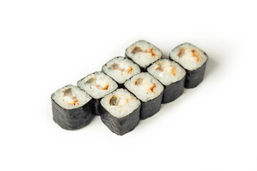 Sushi roll with eel on a white plate, classic Japanese sushi. Traditional Japanese food with maki. Delicious pieces of sushi. For the restaurant menu. copyspace