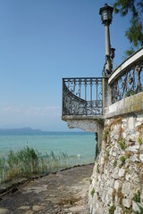 Balcony over a small path at a lake in italy