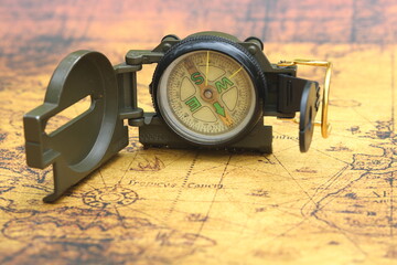 round compass on background of birch bark as symbol of tourism with compass, travel with compass...