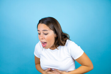 Young beautiful woman over isolated blue background having a nausea