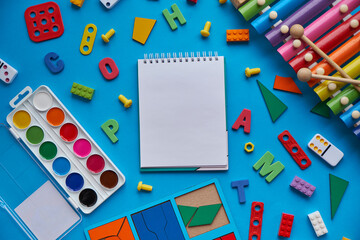 School supplies, stationery on blue background space for caption. Back to school concept. School,...