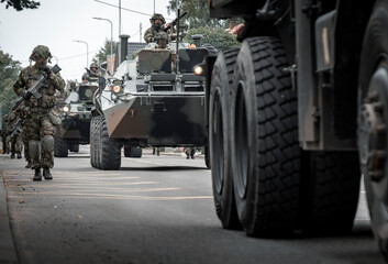 soldiers and armored vehicles enter the city