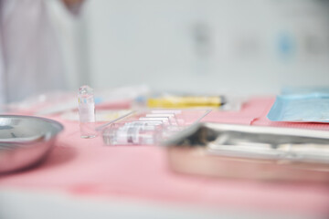 Pharmaceuticals and stainless steel trays used for a medical procedure