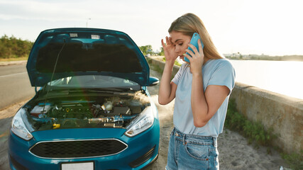 Attractive girl having problems with the car, Young woman using smartphone, calling for assistance...