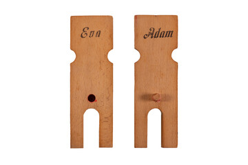 Close up of wooden silhouettes representing Adam and Eve. Concept of procreation