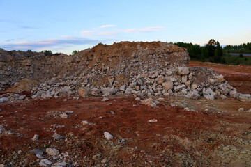 textures of various clay layers underground in  clay quarry after  geological study of  soil. colored layers of clay and stone in  section of  earth, different rock formations and soil layers.