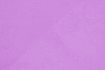 Pink wall of the building. Rough plaster surface. Abstract background.