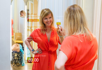 Woman using smart mirror technology in store's fitting room