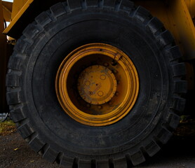 Close up of the wheel of an excavator truck on a construction site.