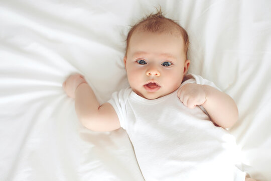 Infant child. The child lies on a blanket.High quality photo.