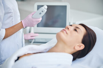 Serious woman waiting for a cosmetic procedure
