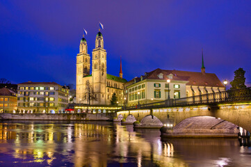 Night view of cathedral Grossmunster  in old city of Zurich, Switzerland.