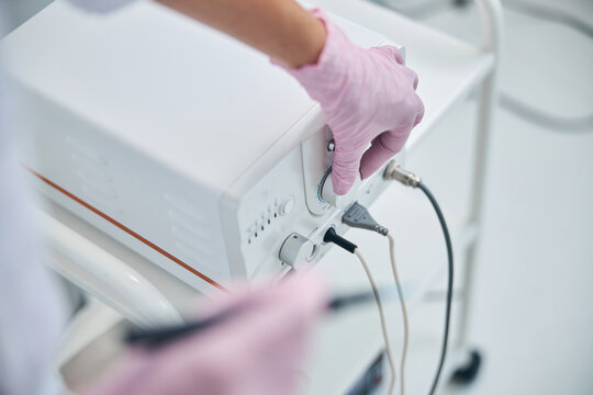 Doctor getting ready for an electrosurgical treatment