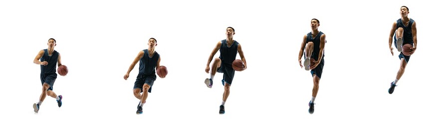 Stronger. Young basketball player of team training in action, motion in jump of step-to-step goal isolated on white background. Concept of sport, movement, energy and dynamic, healthy lifestyle.