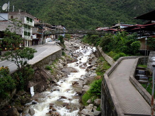Fototapeta na wymiar Aguas Calientes near Cusco in Peru Valley River Bridge