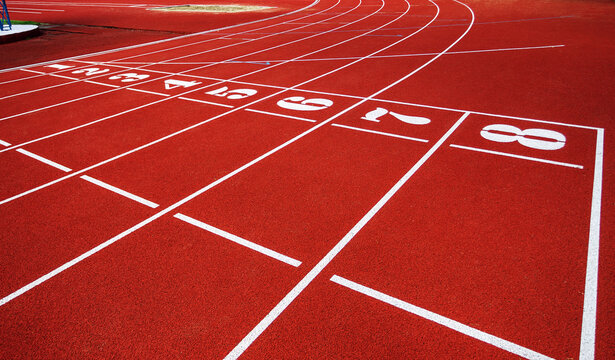 Treadmill with the numbers of the sports stadium. Track, running, red sports field In an open-air treadmill. Track number of the track at the stadium bend © Elena
