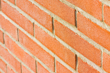 New italian exposed brick wall background without plaster taken from an angled position