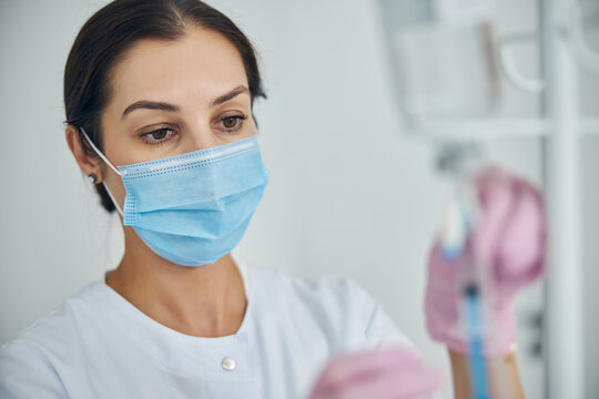 Focused Female Nurse Getting Ready For A Medical Procedure