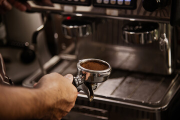 Fototapeta na wymiar barista prepare blend coffee powder to make espresso coffee