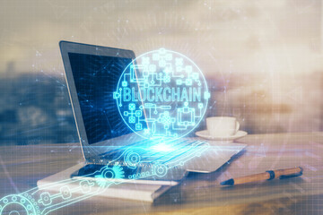Double exposure of blockchain theme hologram and table with computer background. Concept of bitcoin...