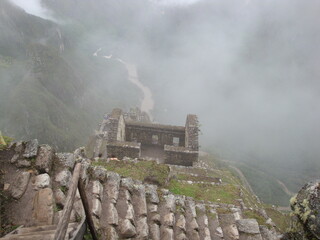 inca ruins of machu picchu in the mist