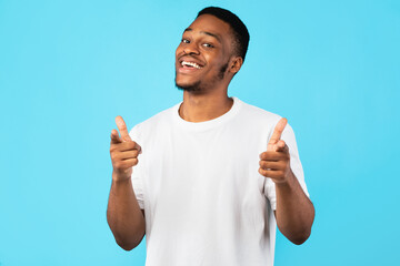 Cheerful Black Man Pointing Fingers At Camera On Blue Background