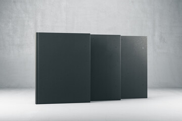 Abstract closed three black hardcover books.