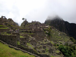 inca ruins of machu picchu in the mist