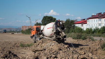 Concrete mixer truck at the construction site.

