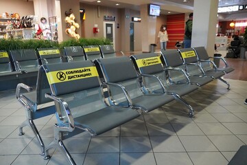 UFA, Russia - August 2020: crown virus, distance for one place from other people at the Airport,...