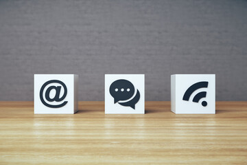Social media icons on white cubes.