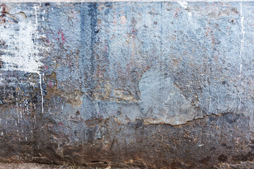 Background texture wall with peeling old paint. Old wooden background with remains of pieces of scraps of old paint on wood. Texture of an old tree, board with paint, vintage background peeling paint