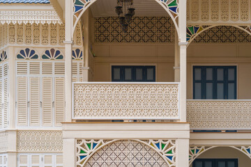 Wooden balcony woodcut trellis panel stencil lattice engraving decorative panel oriental geometric pattern exterior architecture traditional oriental Mosque historical building