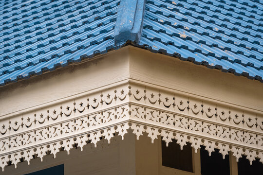 Wooden eaves woodcut trellis panel stencil lattice engraving decorative panel oriental geometric pattern exterior architecture traditional oriental Mosque historical building