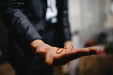 wedding rings on hands of groom