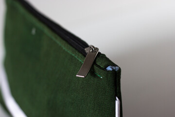 Close up details of a makeup pouch.
Zip and seam