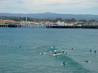 Surfers in Santa Cruz California Pier Ocean