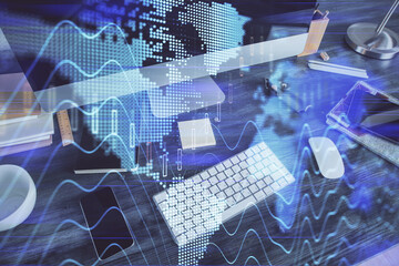 Double exposure of graph and financial info and work space with computer background. Concept of international online trading.