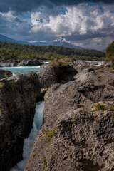 Beautiful Patagonian waterfall in a forest lit by the rising sun of Patagonia